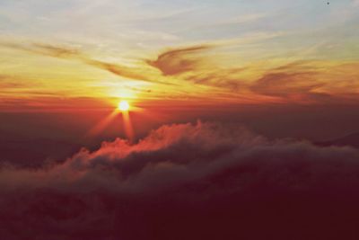 Scenic view of dramatic sky at sunset