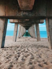 Underneath view of pier at beach