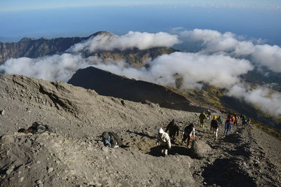 Group of people on volcanic mountain