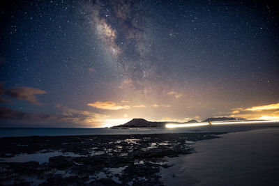 Scenic view of sea against sky at night