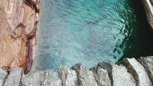 High angle view of rock formation in sea