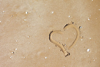 High angle view of heart shape on beach