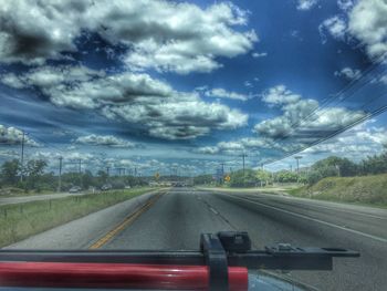 Road passing through car windshield