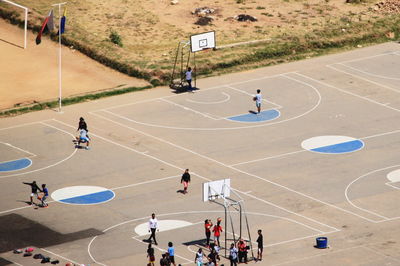 High angle view of people playing at basketball court