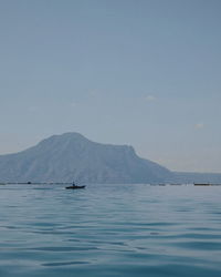 Sailboat in sea against sky