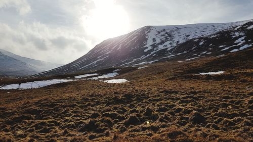 Scenic view of mountains against sky during winter