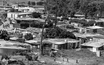 High angle view of houses and buildings in city