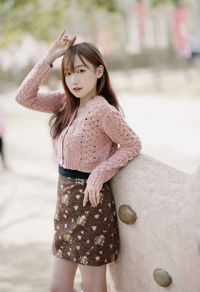 Young woman standing at beach