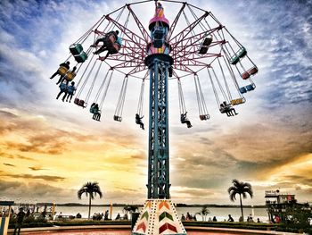 Low angle view of ferris wheel against sky