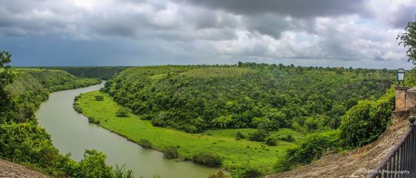 Scenic view of landscape against cloudy sky