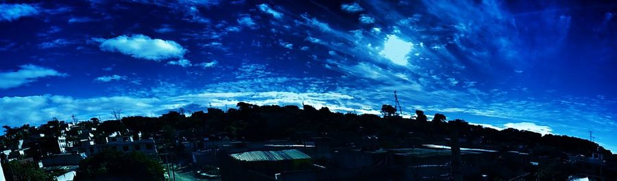 Panoramic view of crowd at night