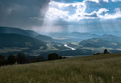 Scenic view of landscape and mountains against sky