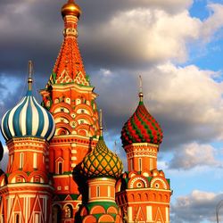 Exterior of st basils cathedral against cloudy sky in city