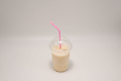 Close-up of drink against white background