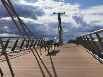 View of bridge against cloudy sky