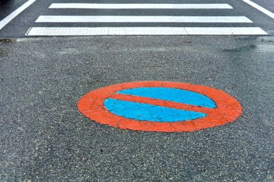 High angle view of road sign on street