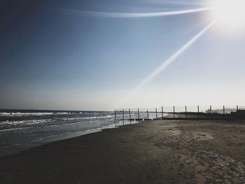 Scenic view of beach against clear sky