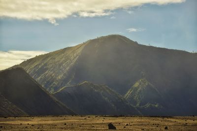 Scenic view of volcanic mountain against sky