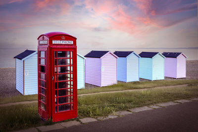 Telephone booth against sky