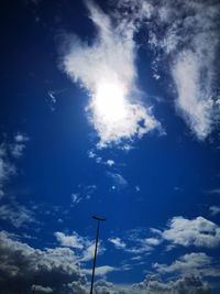 Low angle view of street light against sky on sunny day