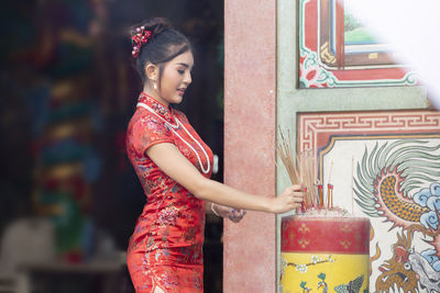 Woman holding incense stick