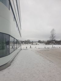 Scenic view of snow covered land against sky