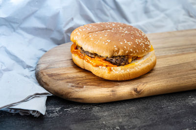 Close-up of burger on serving board