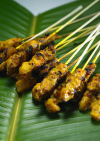 Malaysia famous street food ,grill satay chicken on top of banana leaf