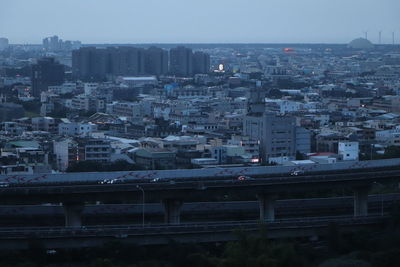 High angle view of buildings against clear sky