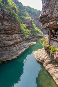 Scenic view of river amidst mountains