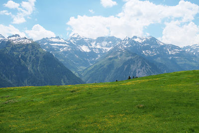 Scenic view of landscape and mountains against sky