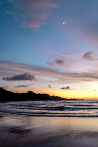 Scenic view of sea against sky at sunset