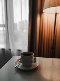 Close-up of coffee cup on table