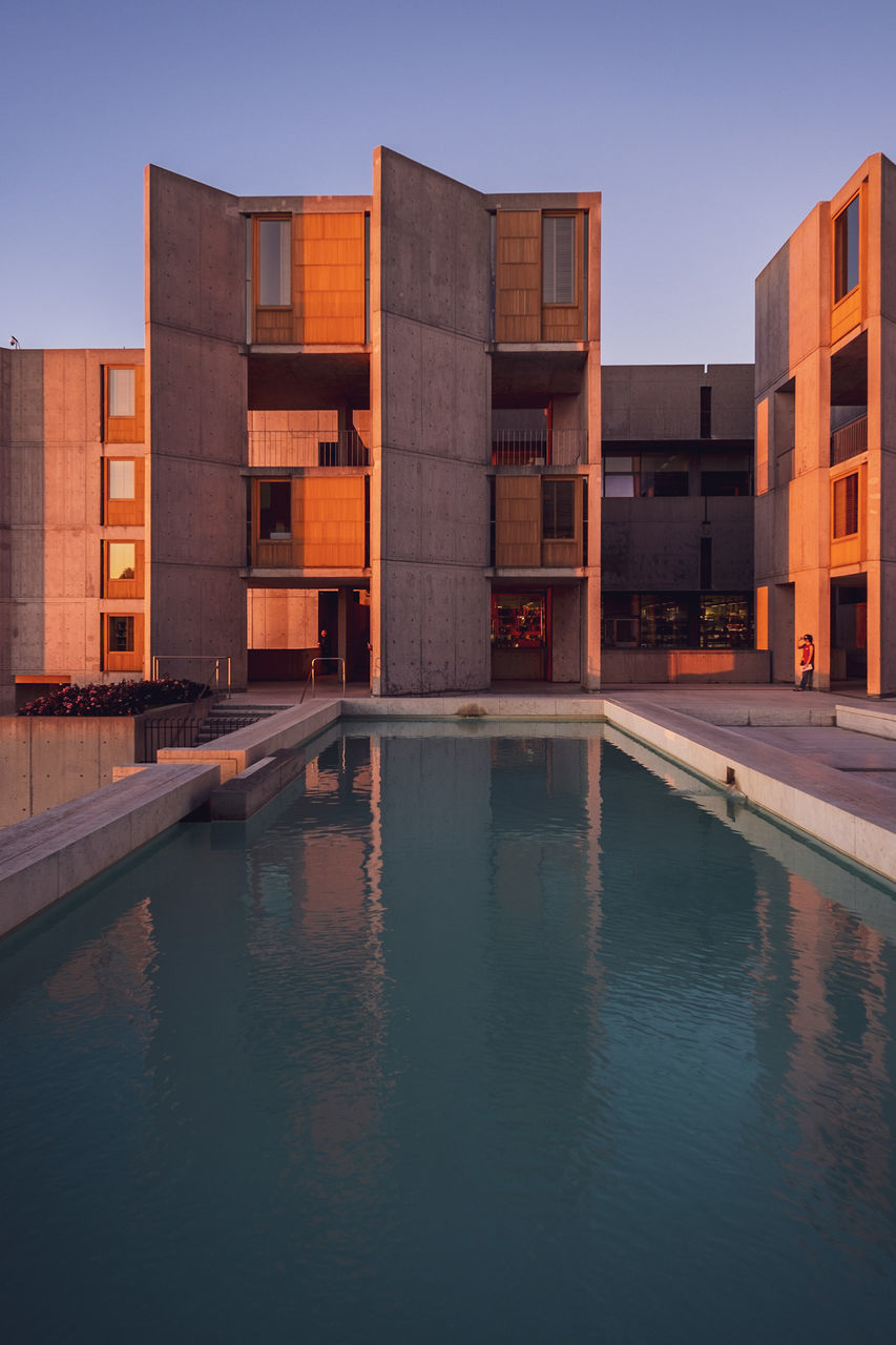 REFLECTION OF BUILDINGS IN SWIMMING POOL