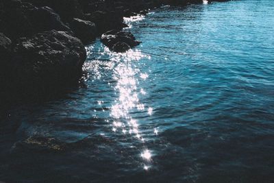 High angle view of rock in sea