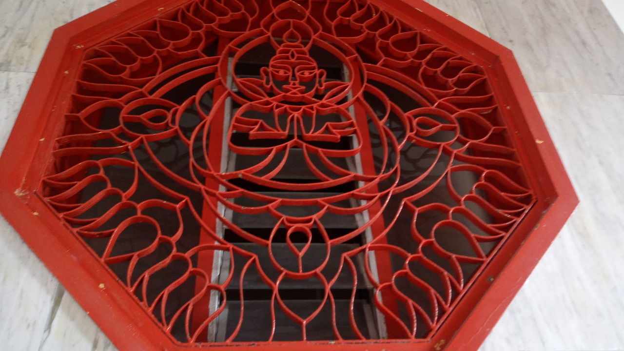 red, close-up, no people, day, pattern, high angle view, outdoors, design, detail, wood - material, built structure, architecture, entrance, wall - building feature, shape, art and craft, nature, decoration, creativity