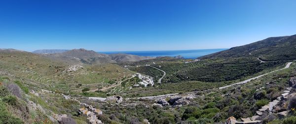 Panoramic view of landscape against clear blue sky