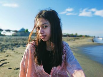 Portrait of a beautiful young woman on beach