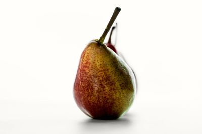 Close-up of fruit over white background