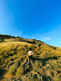 Scenic view of land against blue sky