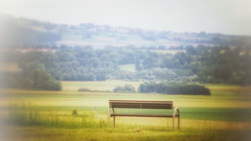 Empty bench on landscape