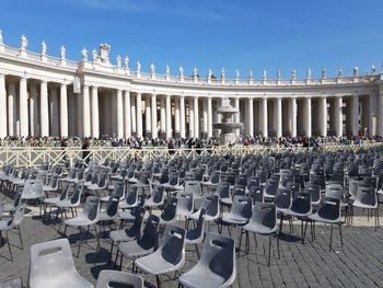 Row of chairs in front of building