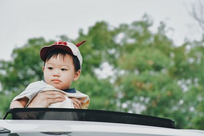 Portrait of boy looking away in car