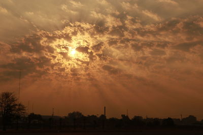 Low angle view of silhouette field against sky during sunset