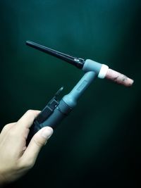 Close-up of hand holding tool