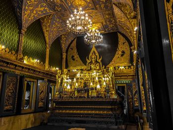 Low angle view of illuminated chandelier in building