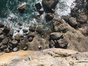 High angle view of rocks in sea