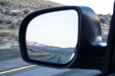 Reflection of car on side-view mirror