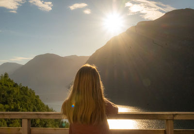 Rear view of woman looking at mountains