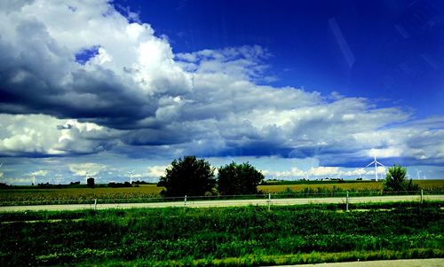 Scenic view of landscape against cloudy sky